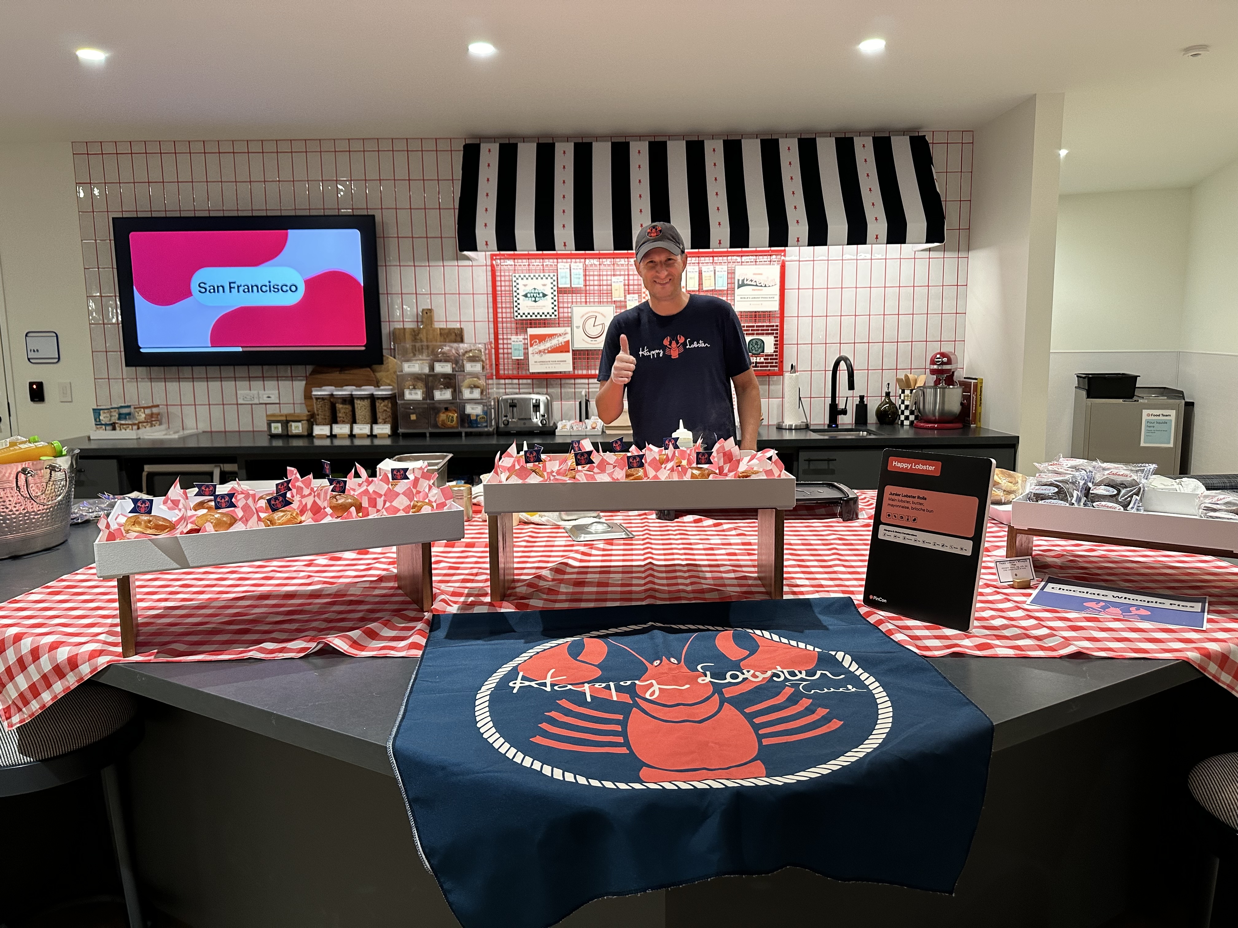 Happy Lobster Bar setup with awning and checkered tablecloth